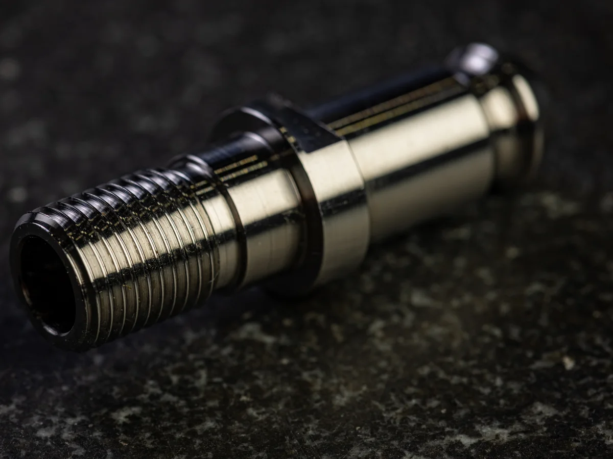 Precision turned stainless aerospace fitting with threads and multiple diameters machined by Metal Essence for NASA HUNCH program